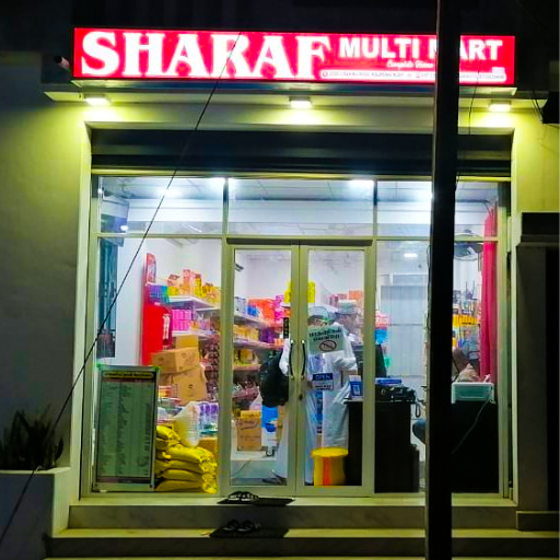 Exterior of Sharaf Multi Mart in Kalmunai, showcasing a vibrant storefront with colorful signage. Interior of Sharaf Multi Mart, Kalmunai, displaying a wide range of imported goods and cosmetics. Sharaf Multi Mart in Kalmunai, featuring neatly arranged shelves stocked with international products