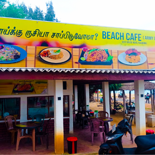 Cozy beach cafe in Kalmunai, Sri Lanka, offering refreshing drinks with a stunning ocean view." "Saboordeen Caffe on Beach Rd, Kalmunai, serving delicious meals near the serene Batticaloa Lagoon." "Relax at a Kalmunai beachfront cafe, enjoying local cuisine and peaceful seaside vibes."